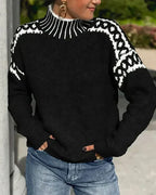 Black knit sweater with white patterned shoulder jacquard and ribbed high neck, long sleeves