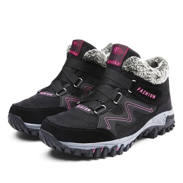 Black winter boots with faux fur collar, hook-and-loop straps, deep lug traction sole