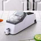 Electric knife sharpener with clear top cover and black insert on white base