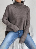 Women’s loose turtleneck sweater, heather gray knit with ribbed cuffs and hem.