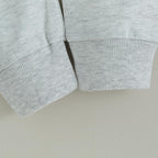 Light gray sweatshirt sleeves with ribbed cuffs