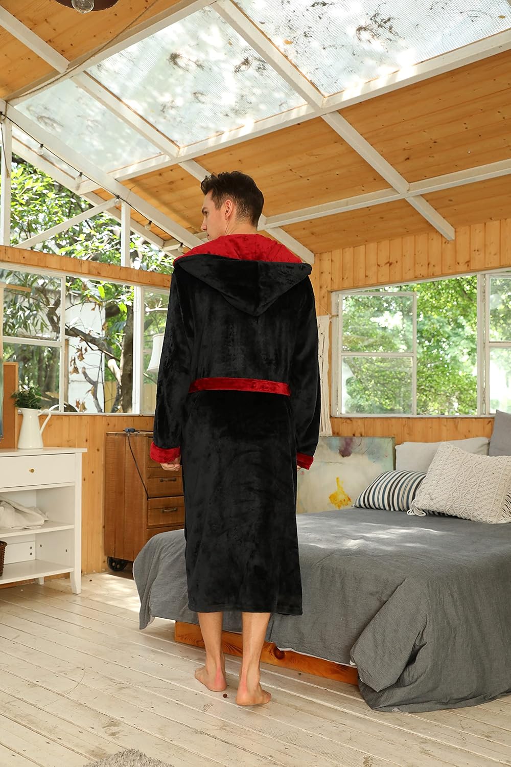 Two-tone hooded fleece robe back view, dark body with red hood lining and belt