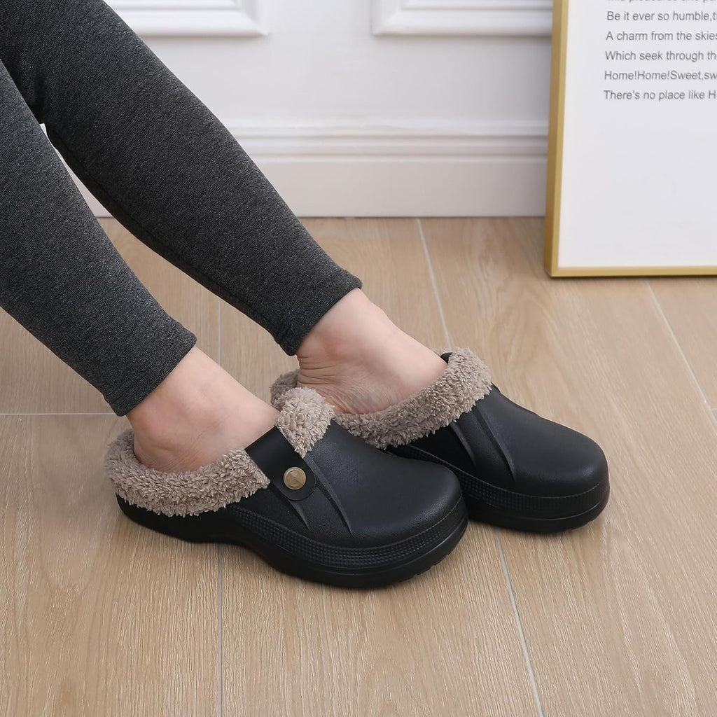 Pair of black plush-lined slip-on clogs worn with socks