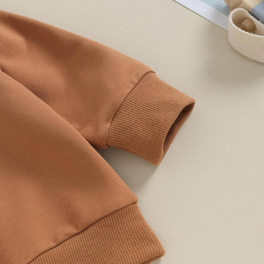 Brown stretch pants with ribbed cuffs and soft knit waistband