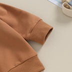 Brown stretch pants with ribbed cuffs and soft knit waistband