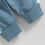 Blue stretch pants with ribbed cuffs and elastic waistband