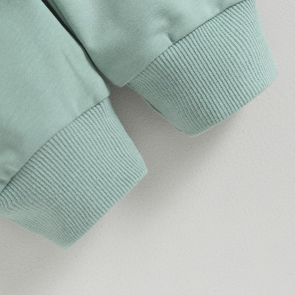 Mint knit cuffs on baby sweatshirt sleeves