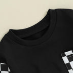 Black baby sweatshirt with ribbed crew neck and white checkered pocket panel