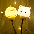 Silicone animal night light pair with chick and cat cups, warm glow