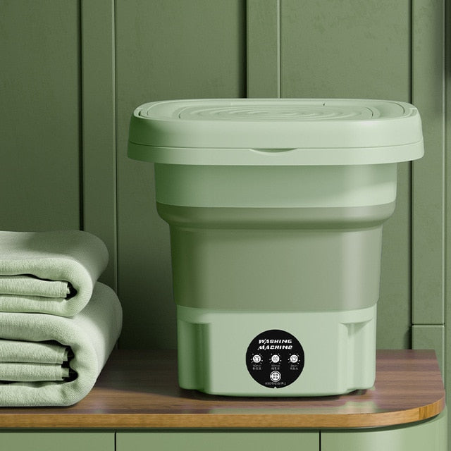 Green collapsible washing bucket with closed lid and control dial