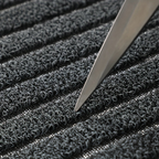 Gray low-profile ribbed entry doormat with dense textured surface and border