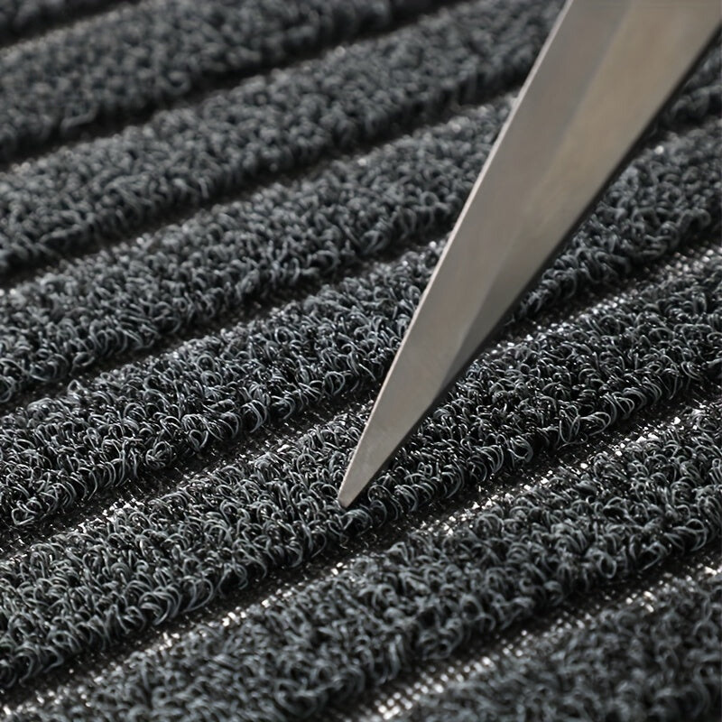 Gray low-profile ribbed entry doormat with dense textured surface and border