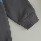 Dark gray stretch pants with ribbed knit cuffs