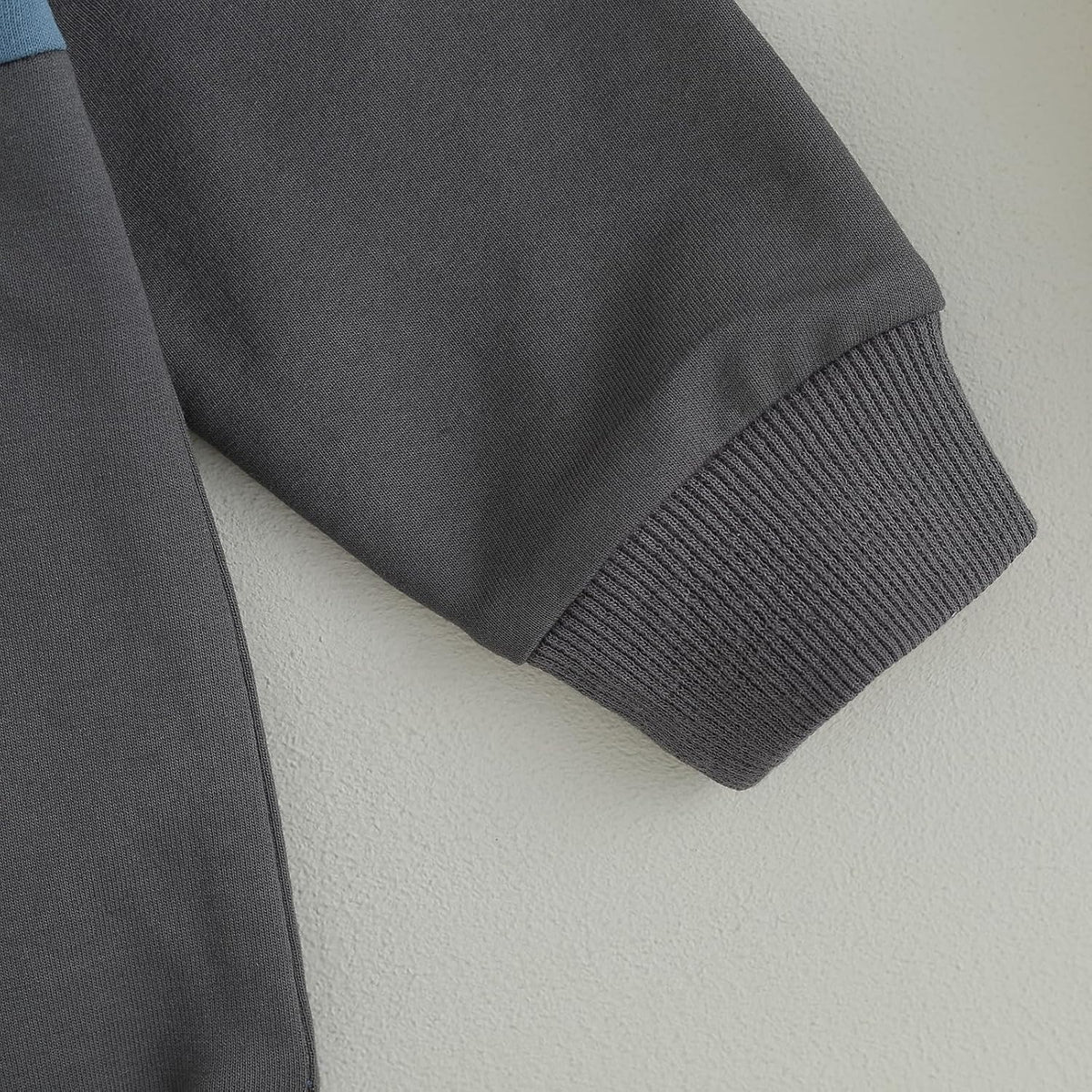 Dark gray stretch pants with ribbed knit cuffs
