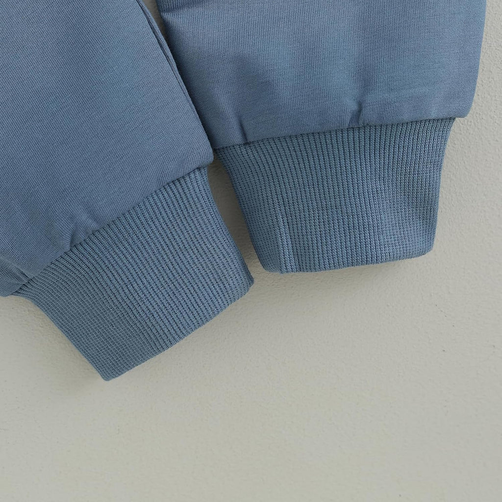 Blue knit cuffs on baby sweatshirt sleeves
