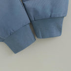 Blue knit cuffs on baby sweatshirt sleeves