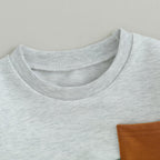 Heather gray sweatshirt with ribbed crew neck and partial pocket detail at side