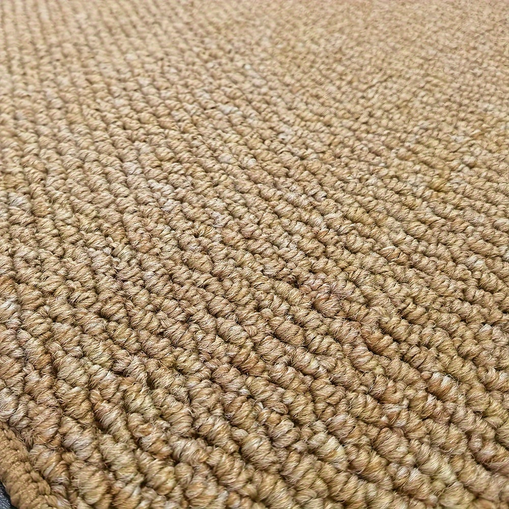 Jute-look doormat surface close-up with tight looped weave in beige.
