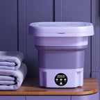 Purple collapsible washing bucket with closed lid and front control dial