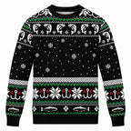 Black Christmas sweater with green and white Fair Isle pattern and snowflake details