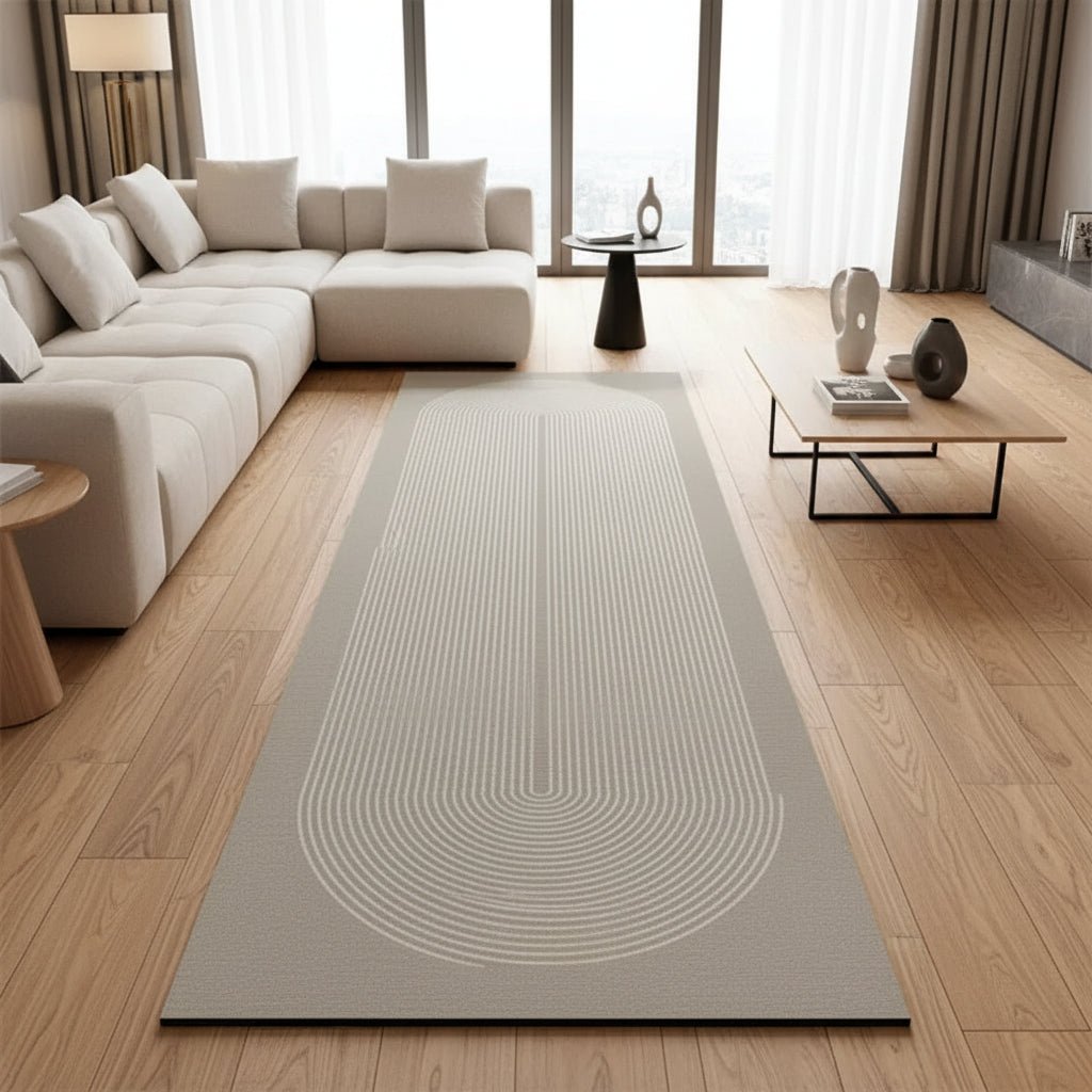 Light gray kitchen rug with concentric swirl pattern and non-slip rubber backing.