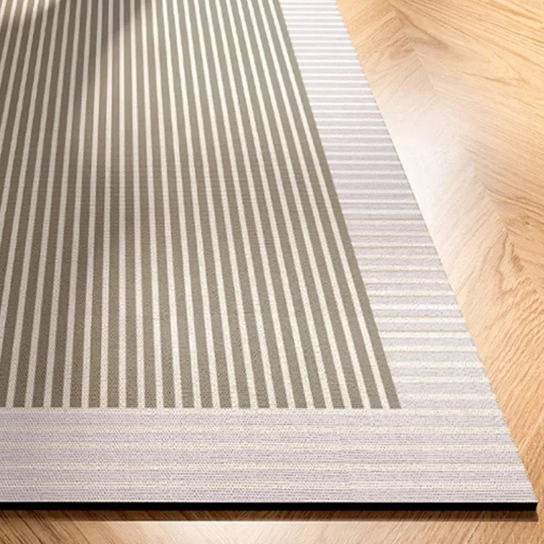 Striped kitchen rug with alternating gray vertical lines and textured low-pile edge.