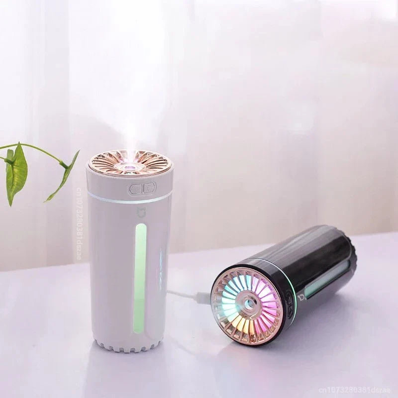 Pink column aroma diffuser humidifier with black car adapter, emitting mist