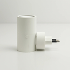 White cylindrical plug-in LED wall light with switch detail and two-prong plug
