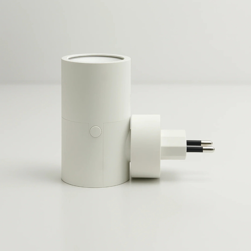 White cylindrical plug-in LED wall light with switch detail and two-prong plug