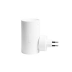 White cylindrical plug-in LED night light with warm-lit top and two-prong plug