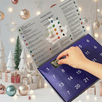 Advent calendar with numbered door sheet as a hand inserts a gemstone into a window