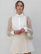 White collared button-up blouse with sheer mesh long sleeves, regular fit