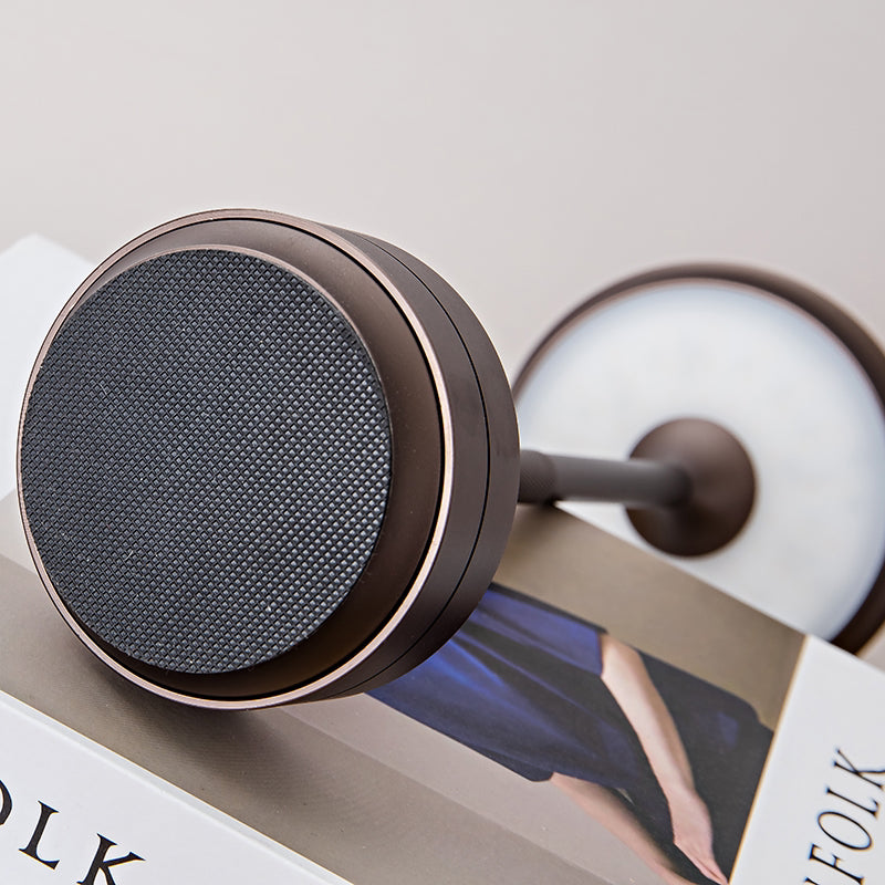 Wireless table lamp head with dark circular LED grille and metal rim
