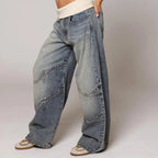 Light blue wide-leg jeans showing side contrast stitching and roomy baggy fit