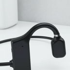 Black open-ear bone conduction headphones, compact speaker arms and headband