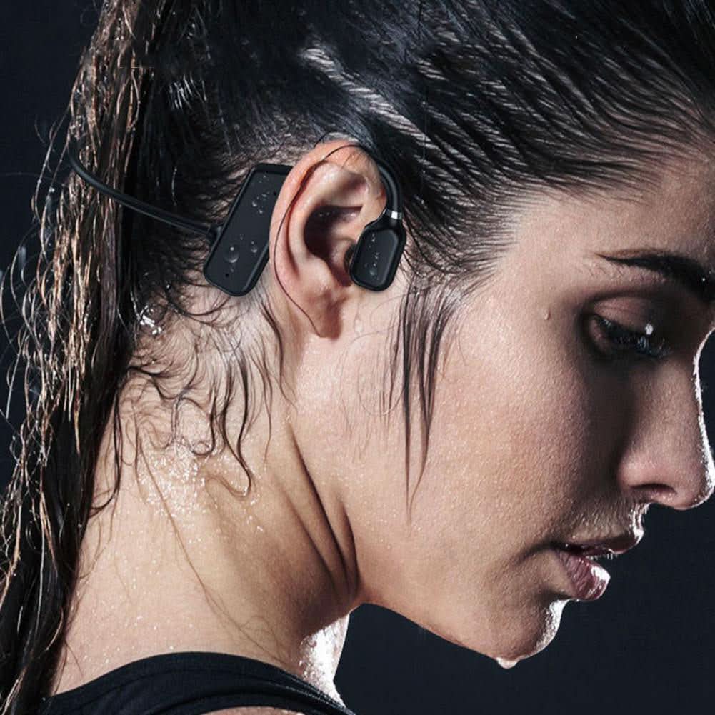 Black open-ear bone conduction wireless headphones worn by woman