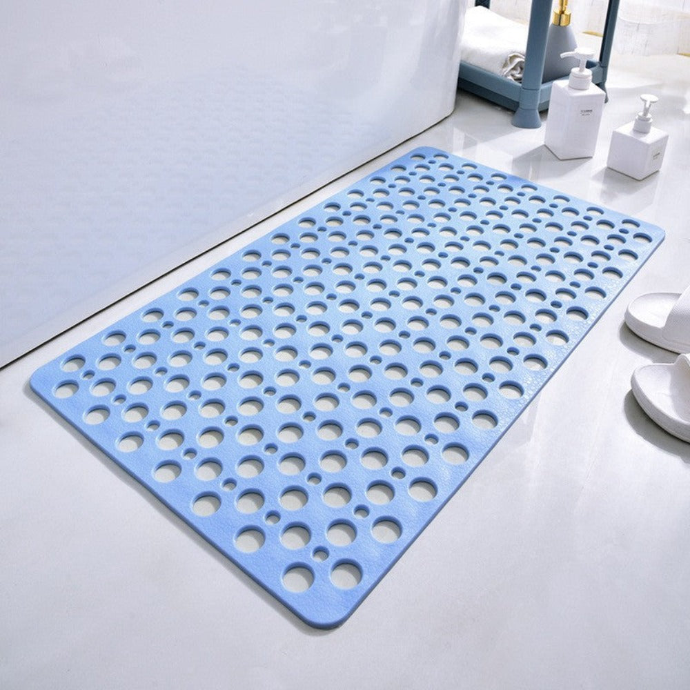 Blue non-slip shower mat with circular drainage holes and square corners.
