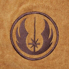 Circular logo patch on brown hooded robe