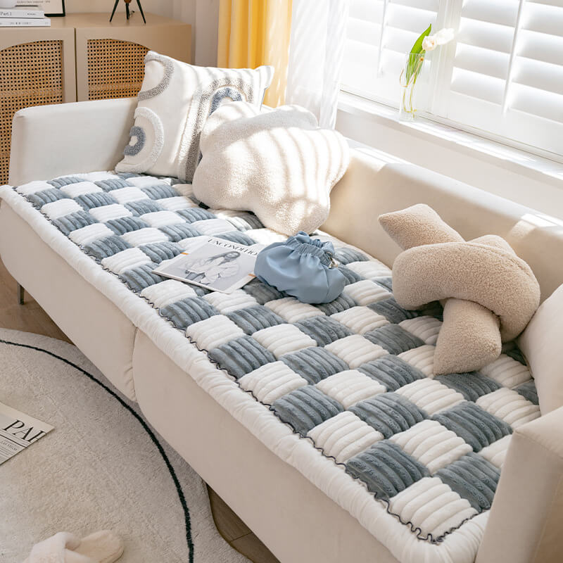 Chenille pet blanket with gray and white striped tiles and scalloped edge