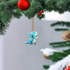 Small blue cartoon dragon keychain pendant hanging from pine branch