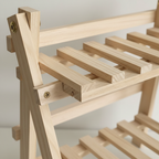 Wood 2-tier desktop shelf with slatted rails and side brackets, close-up