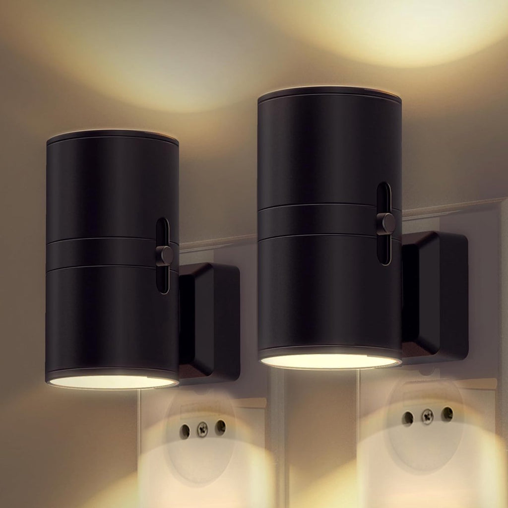 Pair of black cylindrical LED night lights with side switches, wall-mounted