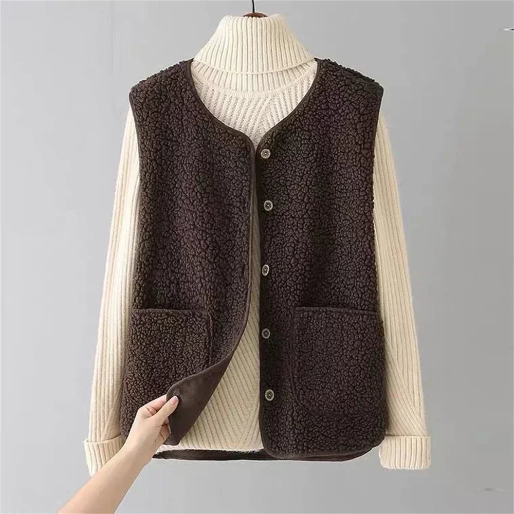 Dark brown sleeveless knit sweater vest over cream ribbed long-sleeve top set
