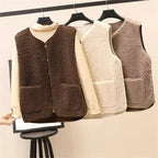 Assorted women’s knit layered vest sets on hangers: dark brown, beige, and light cream