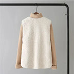 Women’s sleeveless textured vest with cream turtleneck-style knit sleeves in beige