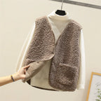 Brown sherpa-textured sweater vest layered over cream turtleneck long-sleeve top set
