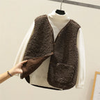 Women’s layered knit set with dark brown textured sleeveless vest over white long-sleeve top