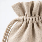 Natural fabric drawstring bag with gathered top and braided string handle