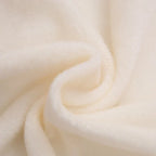 Cream fleece lining fabric swatch for baby snowsuit romper, soft plush texture