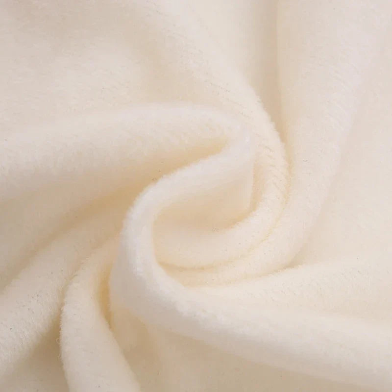 Cream fleece lining fabric swatch for baby snowsuit romper, soft plush texture